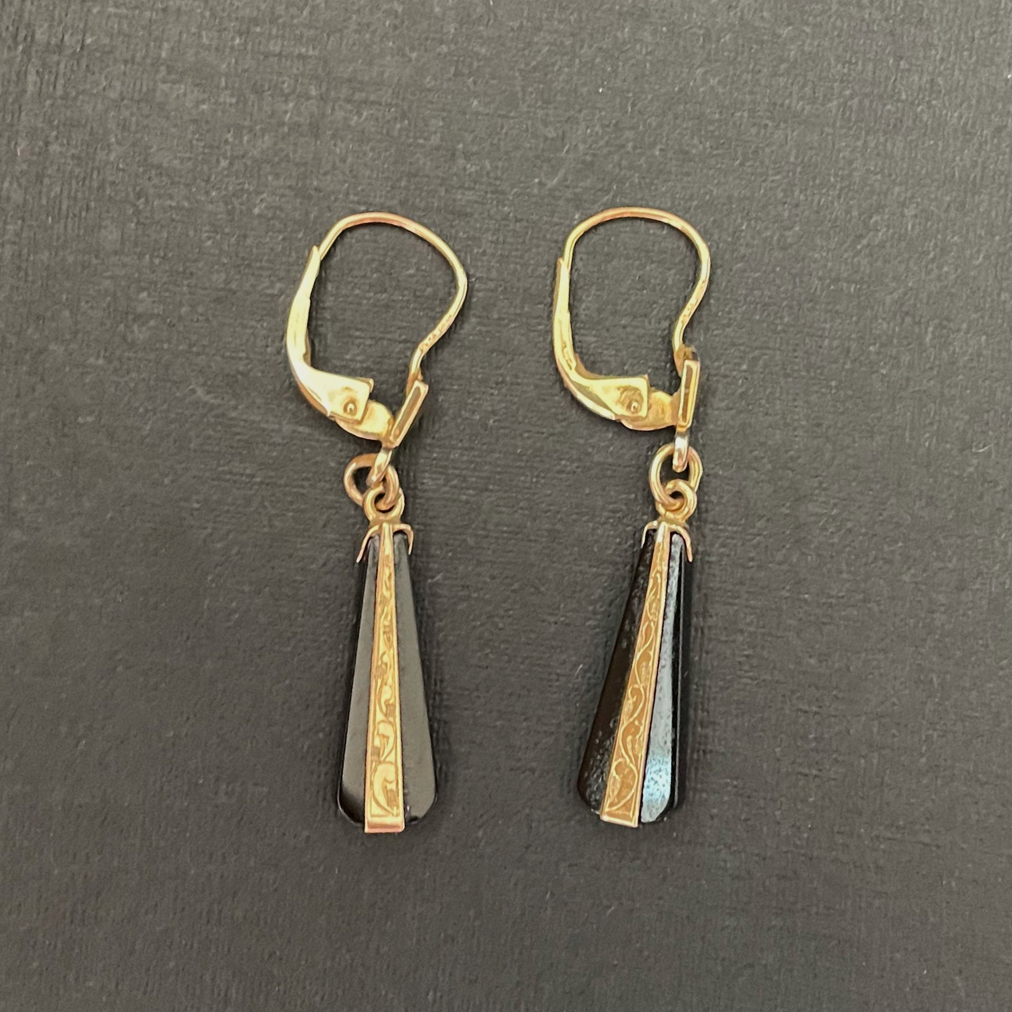 Black onyx drop earrings with etched gold detailing.Black onyx earrings in an art deco style.