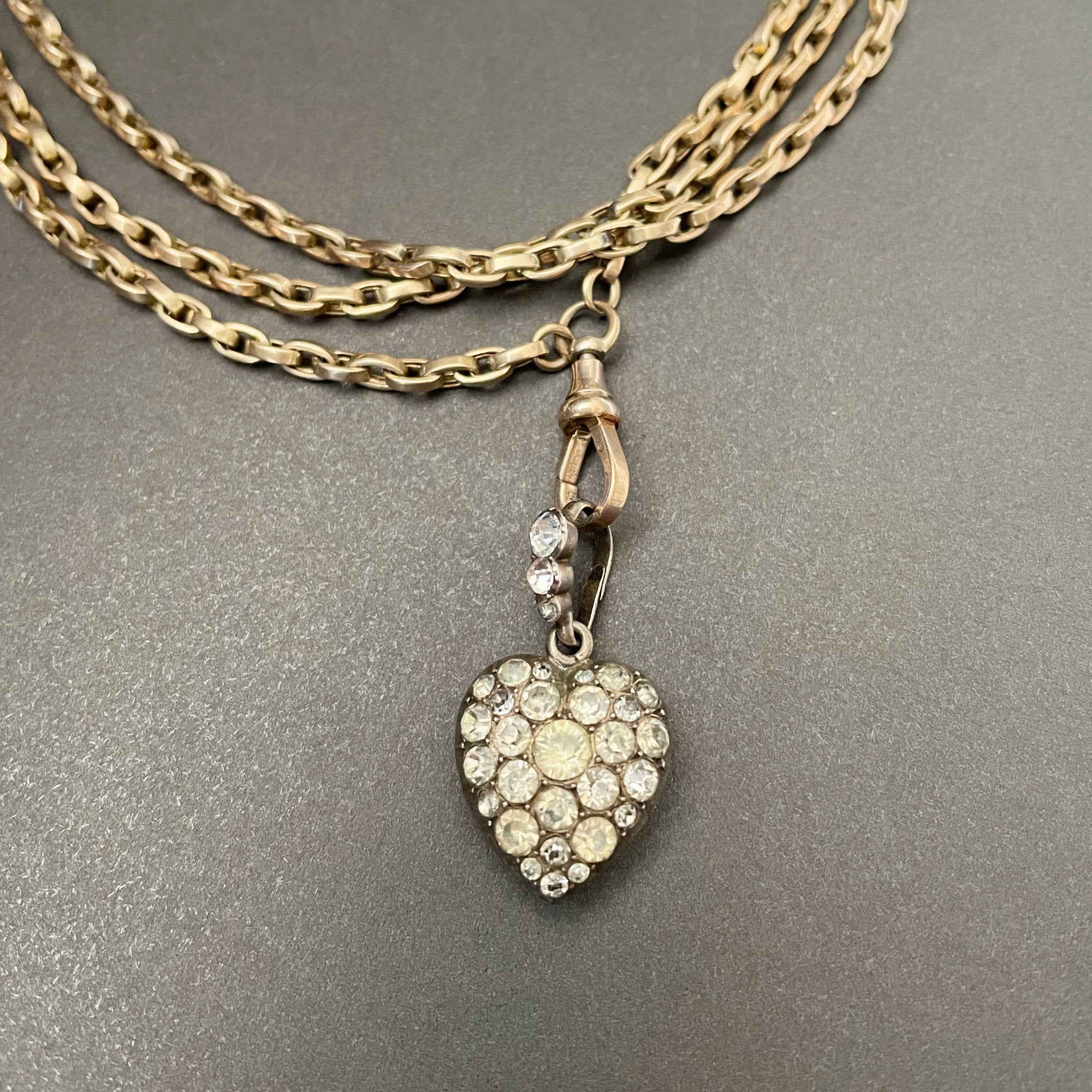 silver heart shaped pendant with colourless paste stones in silver setting