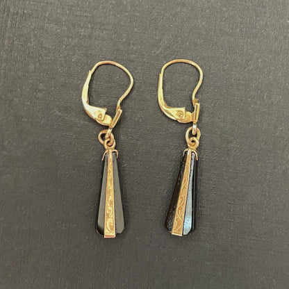 Black onyx drop earrings with etched gold detailing.Black onyx earrings in an art deco style.
