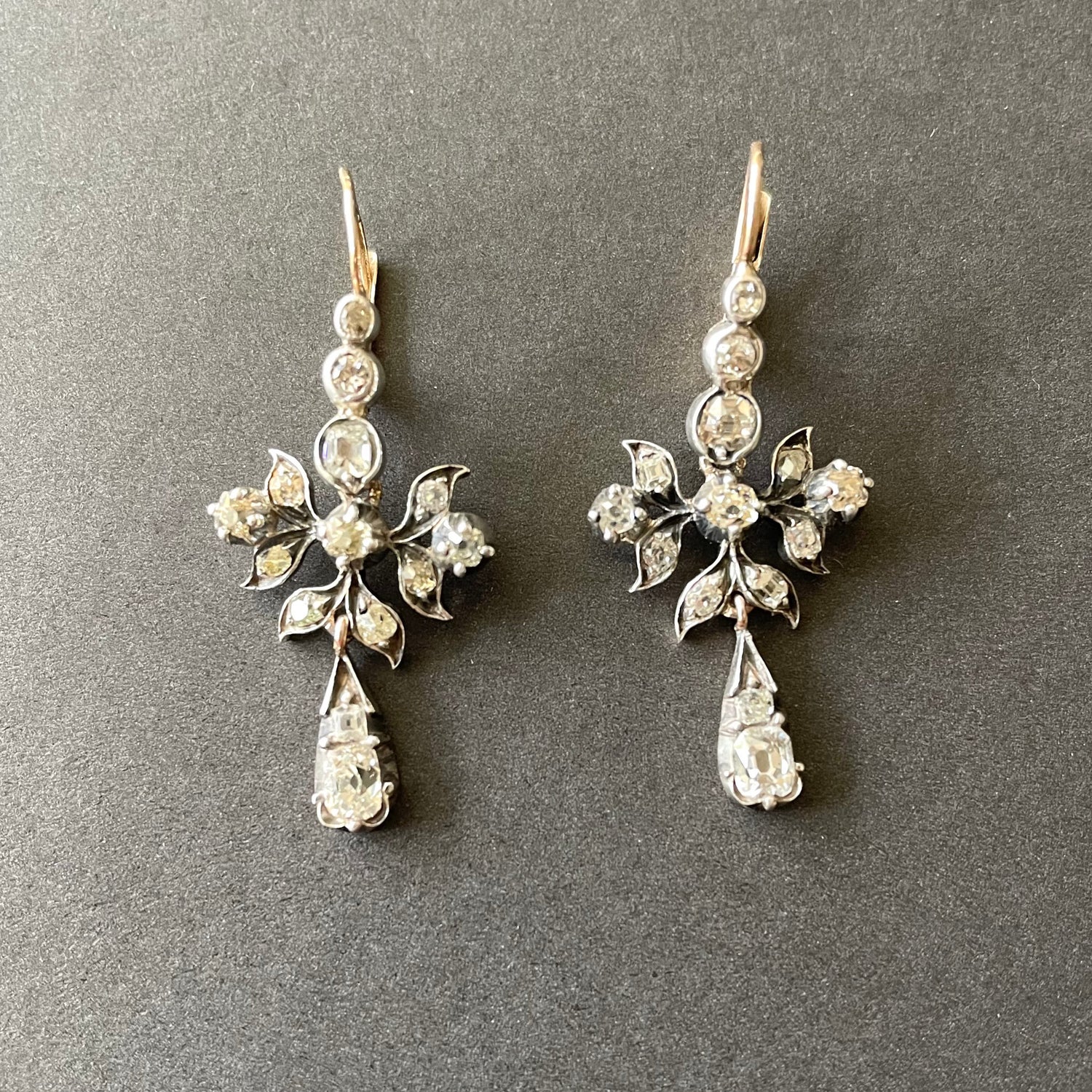 Antique diamond drop earrings set in silver and gold.