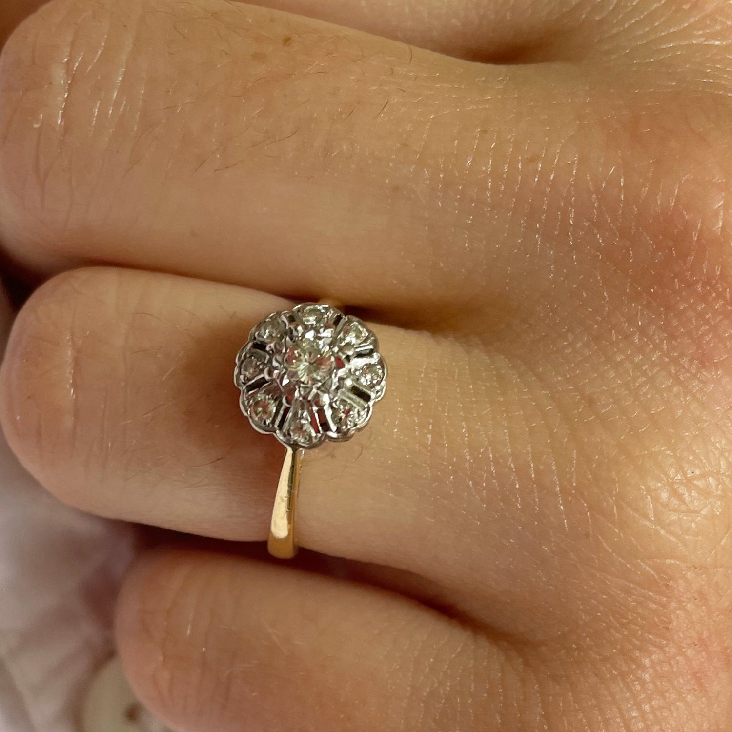 Diamond cluster ring with gold and platinum.