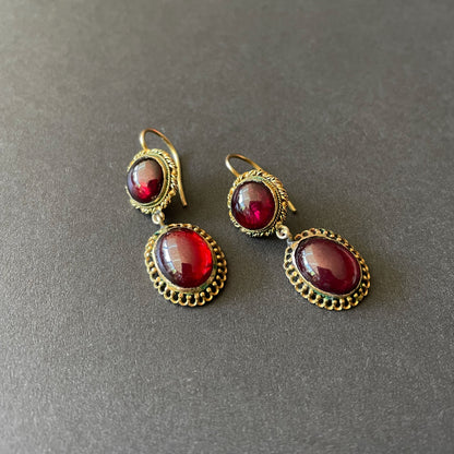 GArnet earrings with braided gold work.