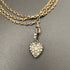 silver heart shaped pendant with colourless paste stones in silver setting