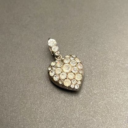 Antique silver heart shaped pendant with colourless paste stones all over.