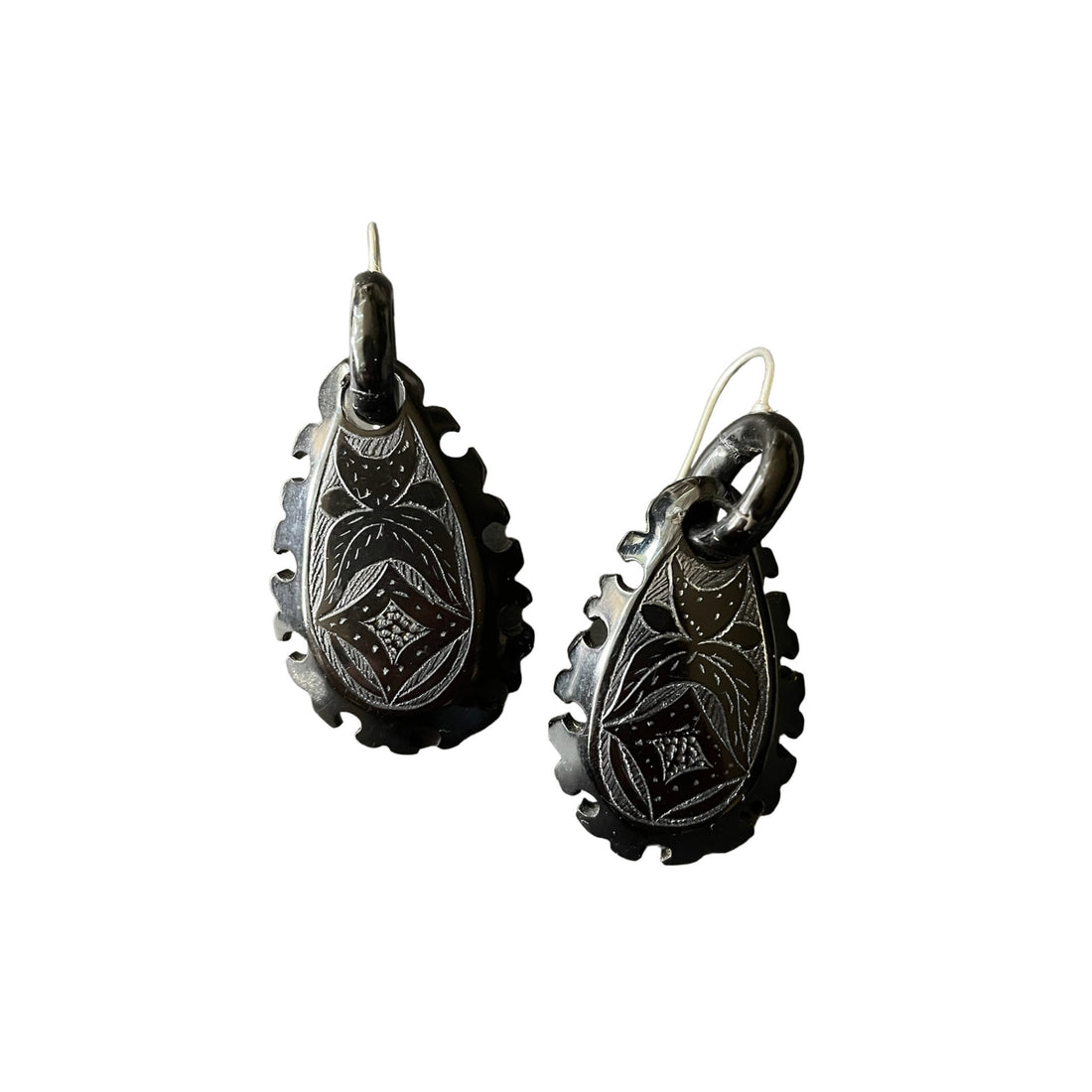 Whitby jet earrings on white background.