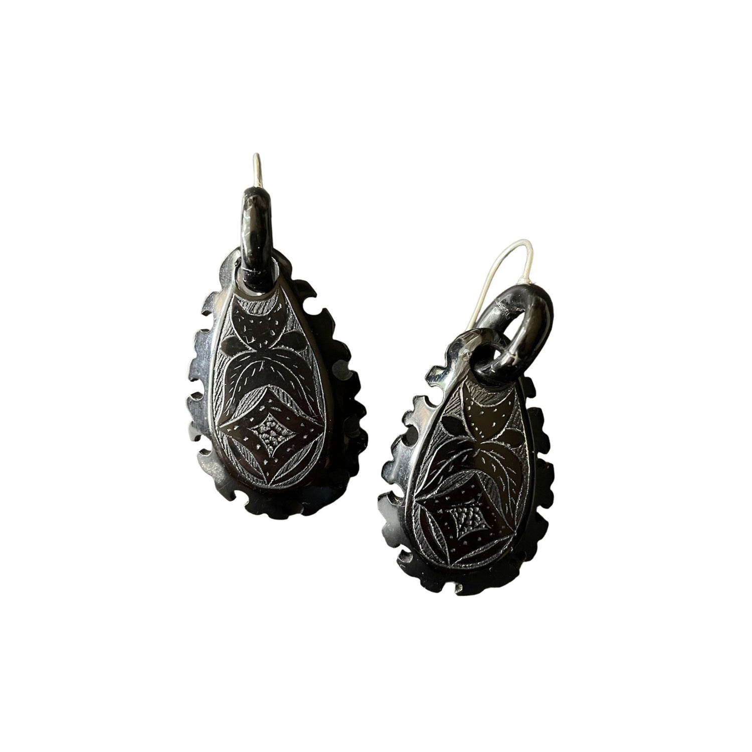 Whitby jet earrings on white background.
