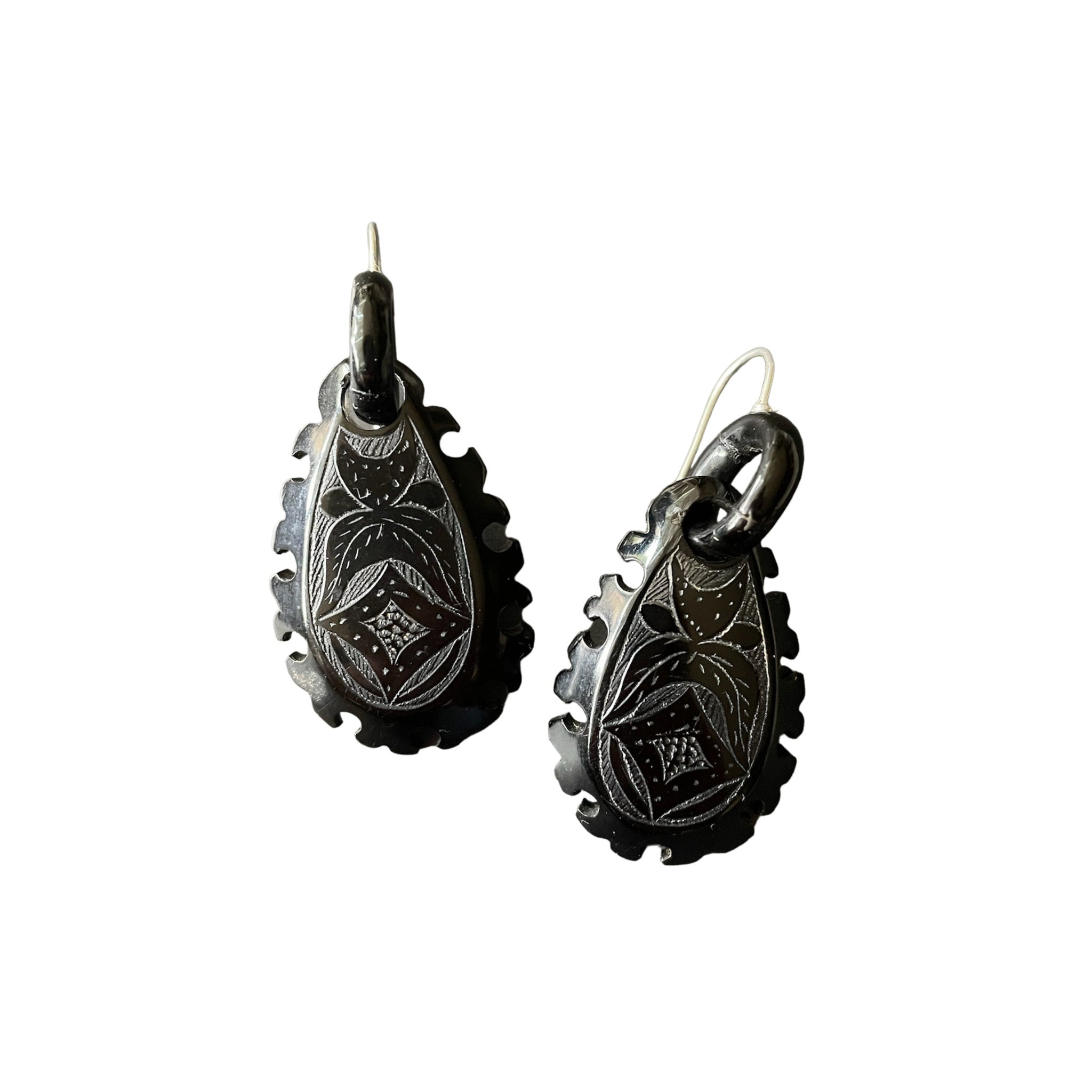 Whitby jet earrings on white background.