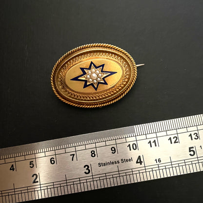 Gold locket next to steel ruler on black background